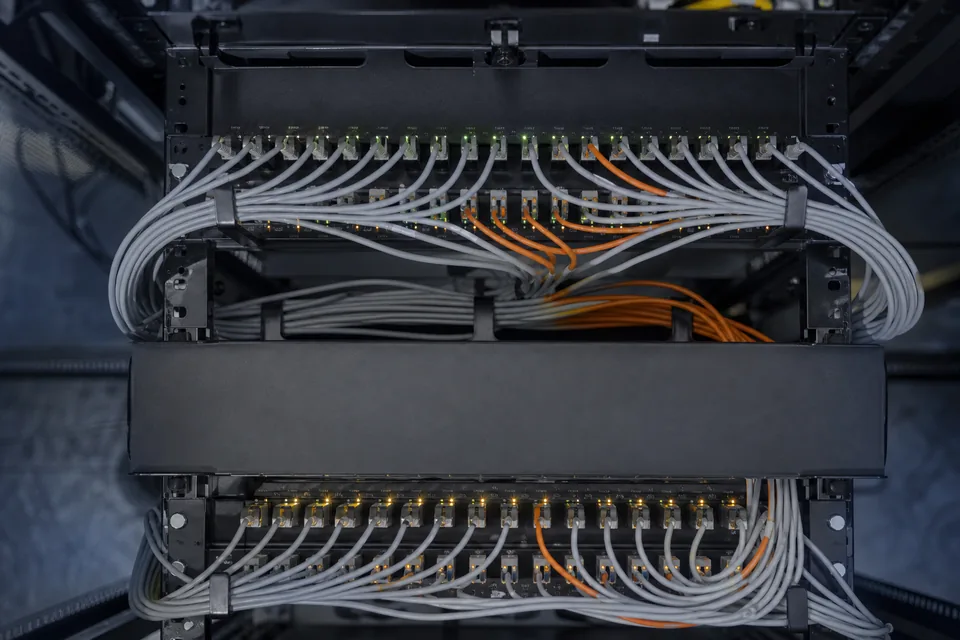 Fiber patch cables connecting two rows of ports, seen from above